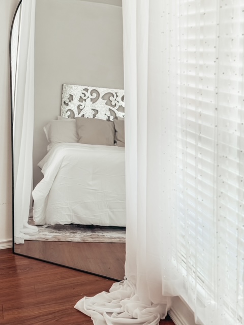 Mirror and soft curtains in the boudoir room