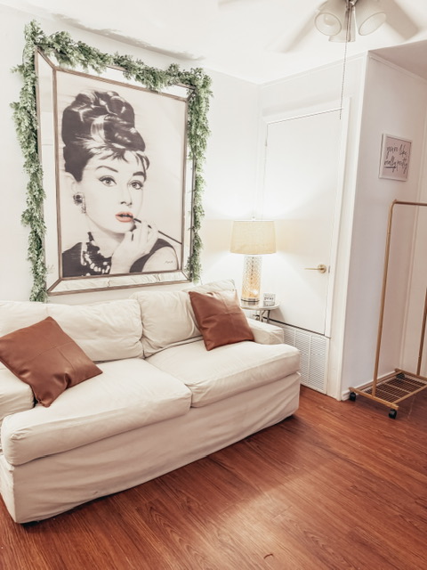 Sofa and wall art in the glam room